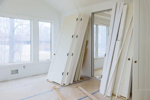 New interior doors staged in a room before installation by Build By Manny in Knoxville, TN