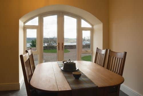 French patio doors installed in an arched opening by Build By Manny in Knoxville, TN