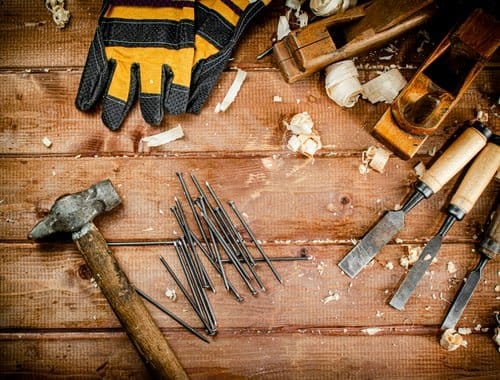 Carpentry hand tools, chisels and hammer on a workbench — general carpentry by Build By Manny in Knoxville, TN